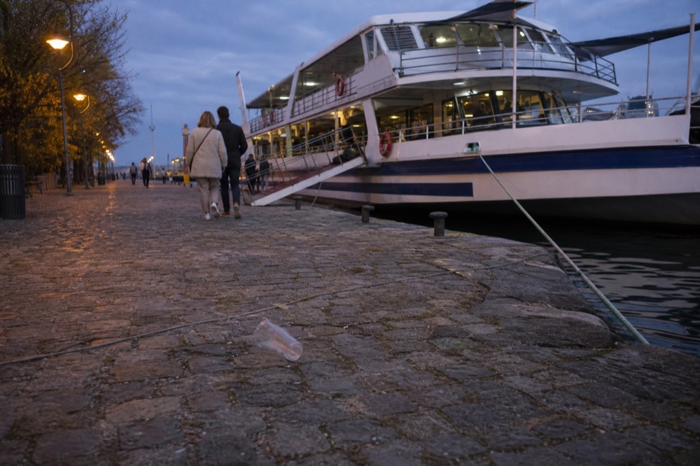 A Seine cruise boarding pier with a moored boat and evening lights, no text, no logos, no people